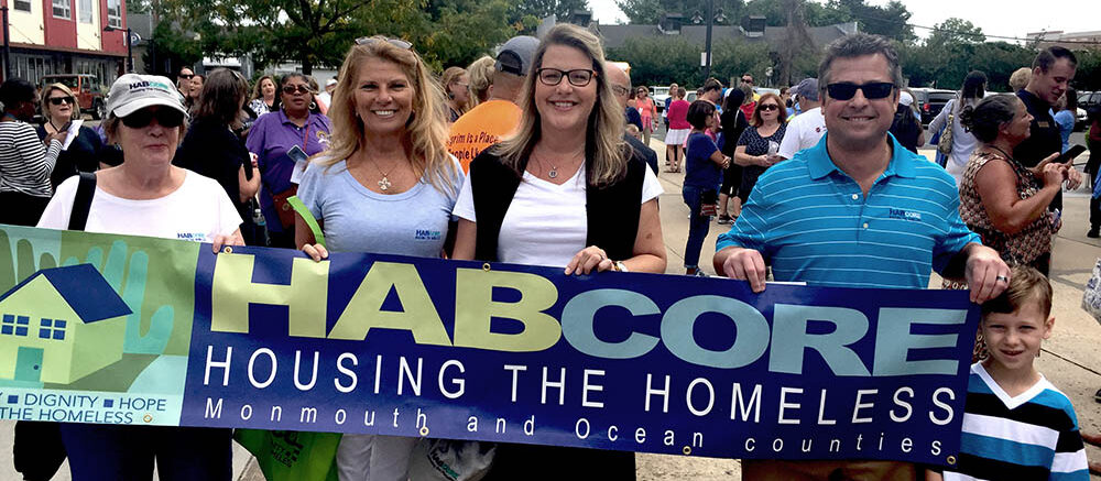 Executive team with HABcore banner