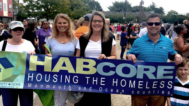 Executive team with HABcore banner