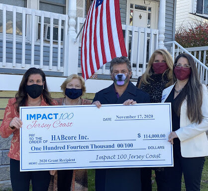 HABcore with a big check from the Impact 100 grant