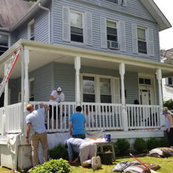 volunteers working on the River Avenue house